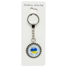Брелок в упаковці серце в долонях Україна скло